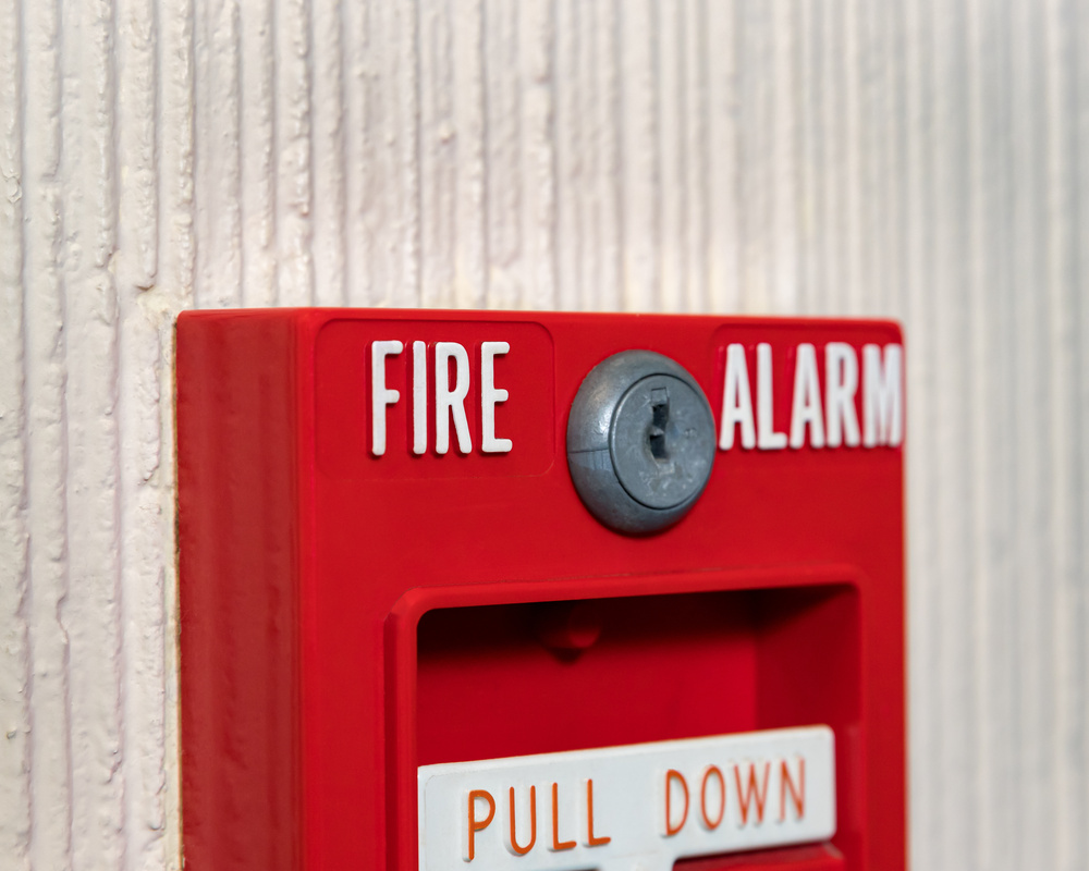 Closeup of fire alarm pull station call box. Concept of emergency, alert, public safety and panic